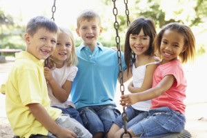 Group Of Children Having Fun In Playground Together